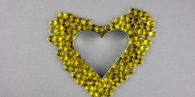 vitamin d3 supplements arranged into a heart shape