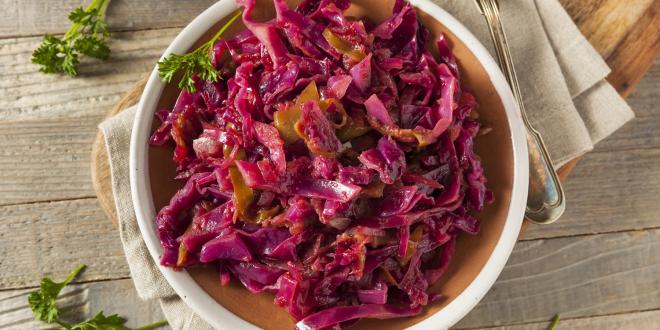 a bowl of red cabbage braised with apples